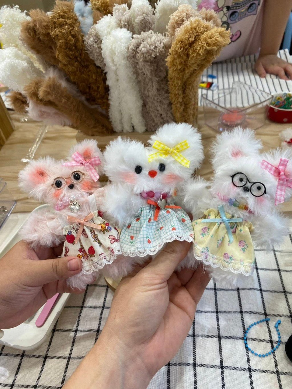 Three fluffy coquette Moru dolls in Playlab Studio Bangkok